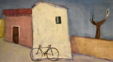 Casa bianca con bicicletta